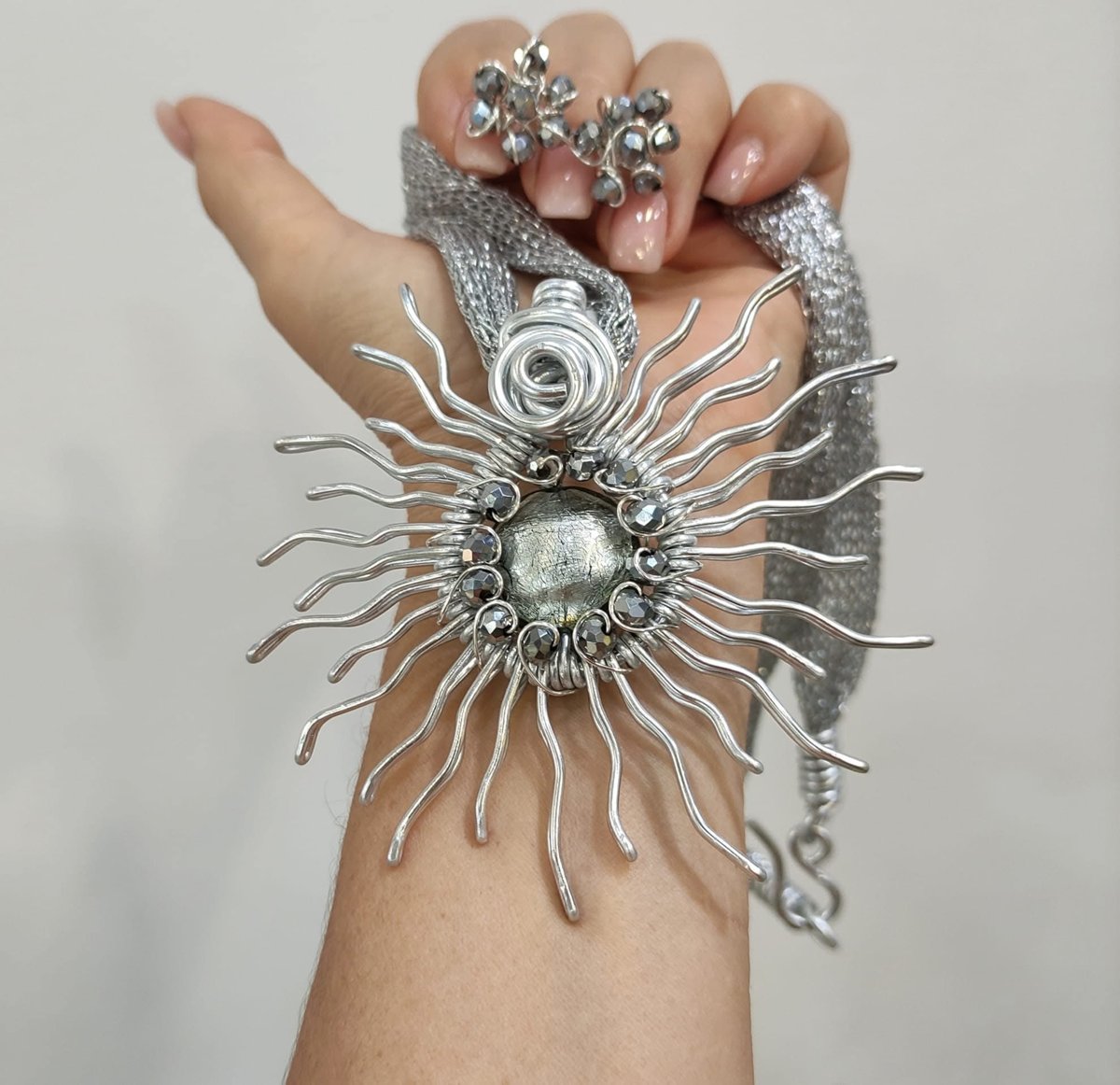 Sole con perla di Murano